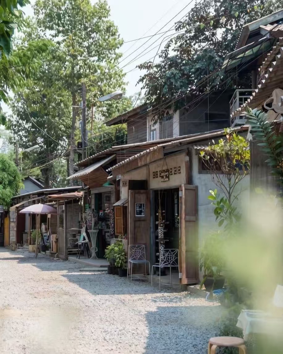 A quiet lane of wooden shops and studios